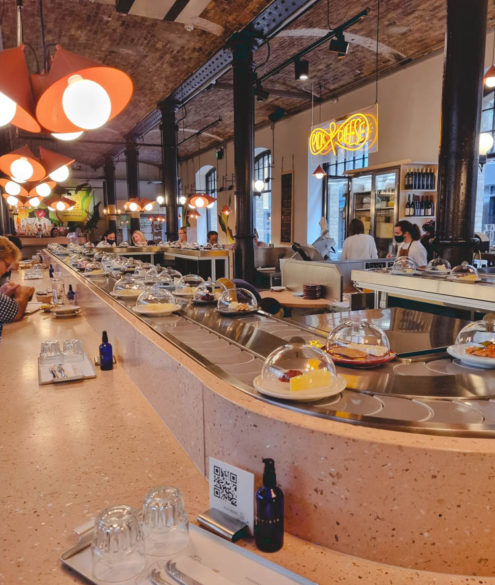 Pick and cheese conveyer belt in London restaurant bar