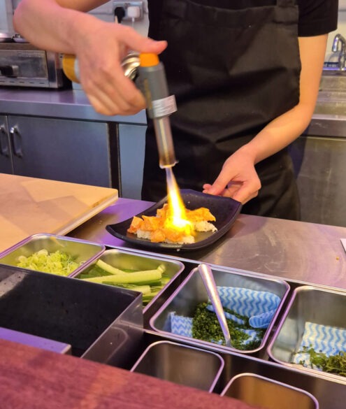 Blowtorching burnt salmon at Kumori handroll restaurant review Soho, London