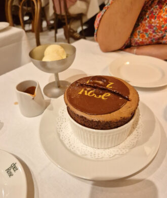 Sharing chocolate souffle dessert at Chez Rose restaurant review Mayfair
